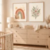 Boho rainbow and floral wall art displayed above a nursery dresser